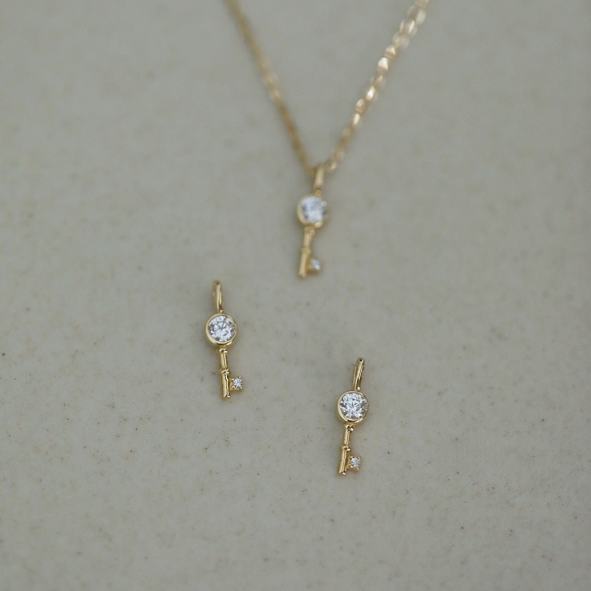 COLLIER AGT GOLD OZ CLE